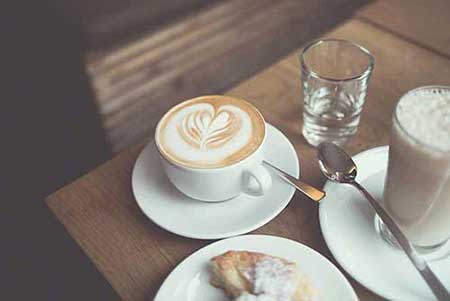 Coffee and pastry in a cafe photo
